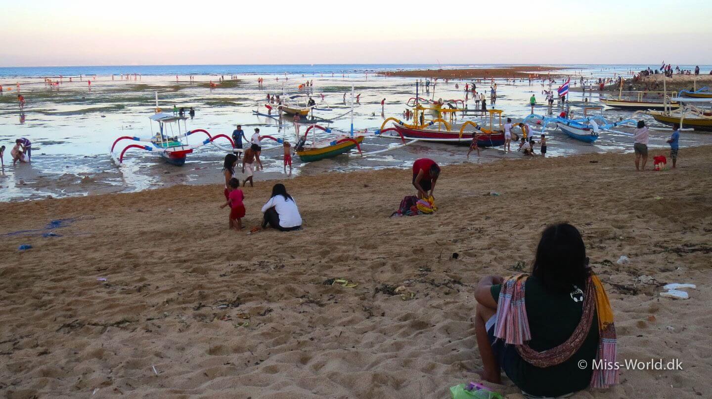 Lowtide - Balinese people gathering in the sunset, Sanur Beach Bali
